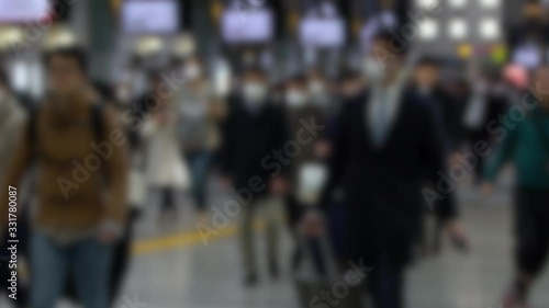 Wallpaper Mural Slow motion Blurred defocused view of Japaneses travellers wear mask at Shinagawa Station to prevent infection from coronavirus. The virus has caused emergency situation.-Dan Torontodigital.ca