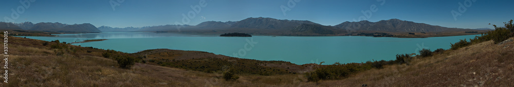 Panoramic view of Lake Tekapo from hiking track Peninsula Walkway on South Island of New Zealand