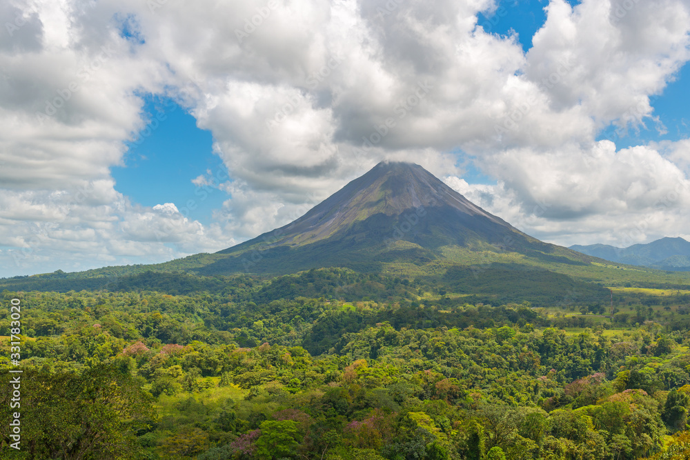 Landscape of the tropical rainforest and its canopy of the active Arenal volcano on a summer day near La Fortuna, Costa Rica, Central America.
