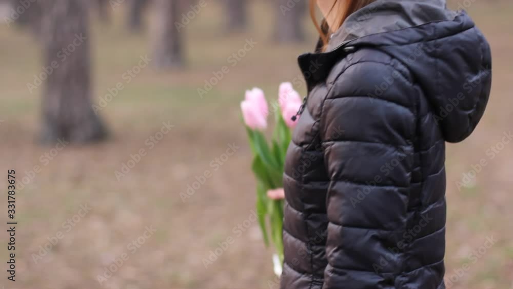 Flowers in the hands of a girl. Tulips in spring Flowers in the hands of a girl. Tulips in spring