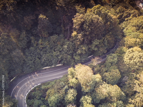 Mountain road traffic. Aerial top down drone shot. © Igor Krivosheev