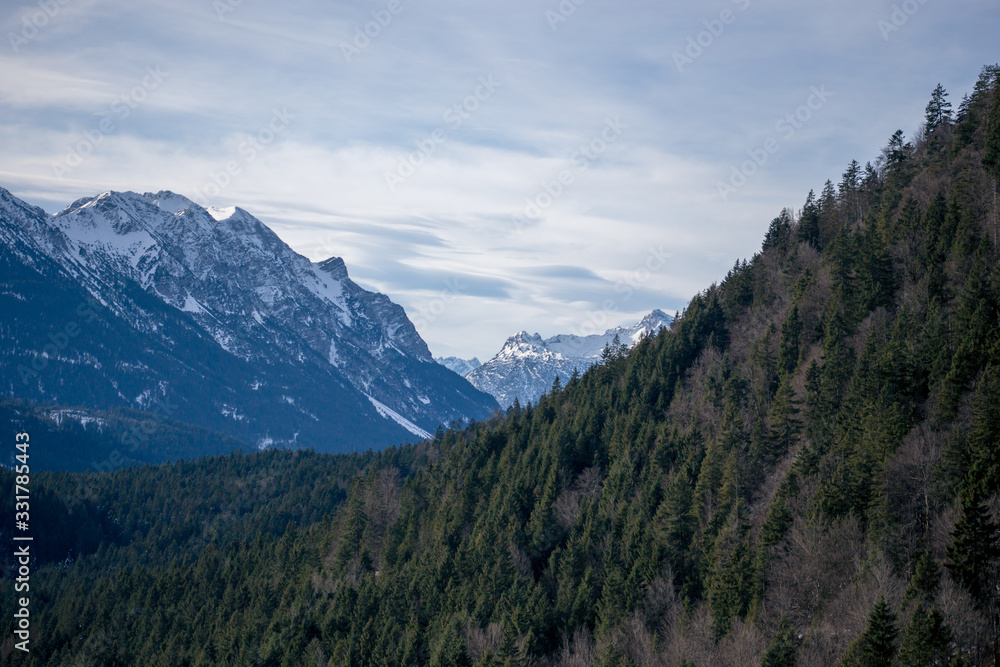 High alpine mountains with snow in Germany and blue beautiful sky