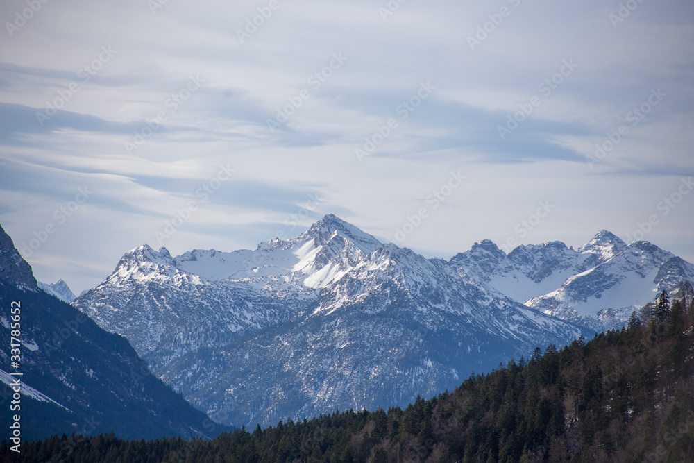 High alpine mountains with snow in Germany and blue beautiful sky High alpine mountains with snow in Germany and blue beautiful sky