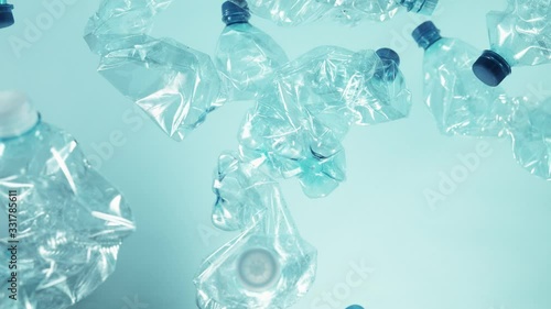 Super slow motion of empty plastic bottles flying into the air. Filmed on high speed cinema camera, 1000 fps.