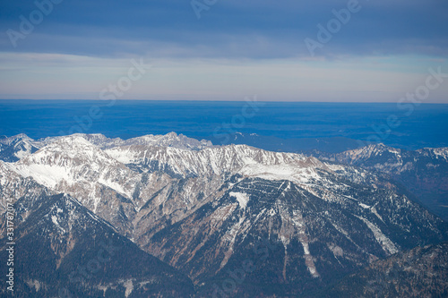 High alpine mountains with snow in Germany and blue beautiful sky