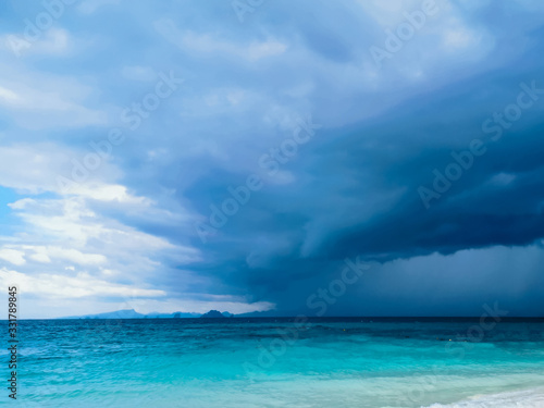 Bamboo island Paradise with blue water and boats on the eve of a tropical downpour and storm Thailand © ksyusha_yanovich