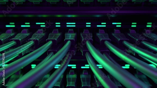 Close-up View of Modern Internet Network Switch With Plugged Ethernet Cables. Blinking Lights on Internet Server. Concept of Data Center, Cloud Computing and Telecommunications. Endless Loop.