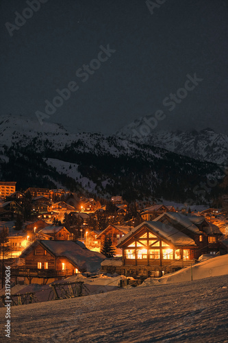 night time view of monginevro montgenevre chalets