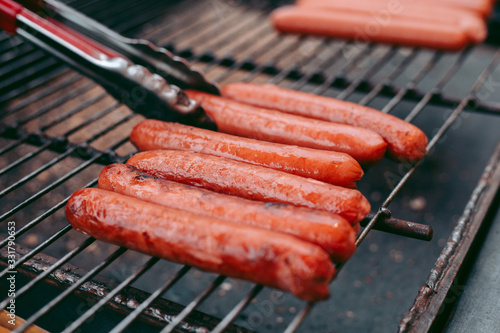 Photography Delicious fresh hot dogs on the grill