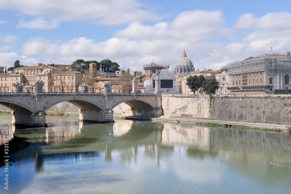 Saint Peter Basilica in the Vatican, from across the Tiber river bridge of Sant'Angelo