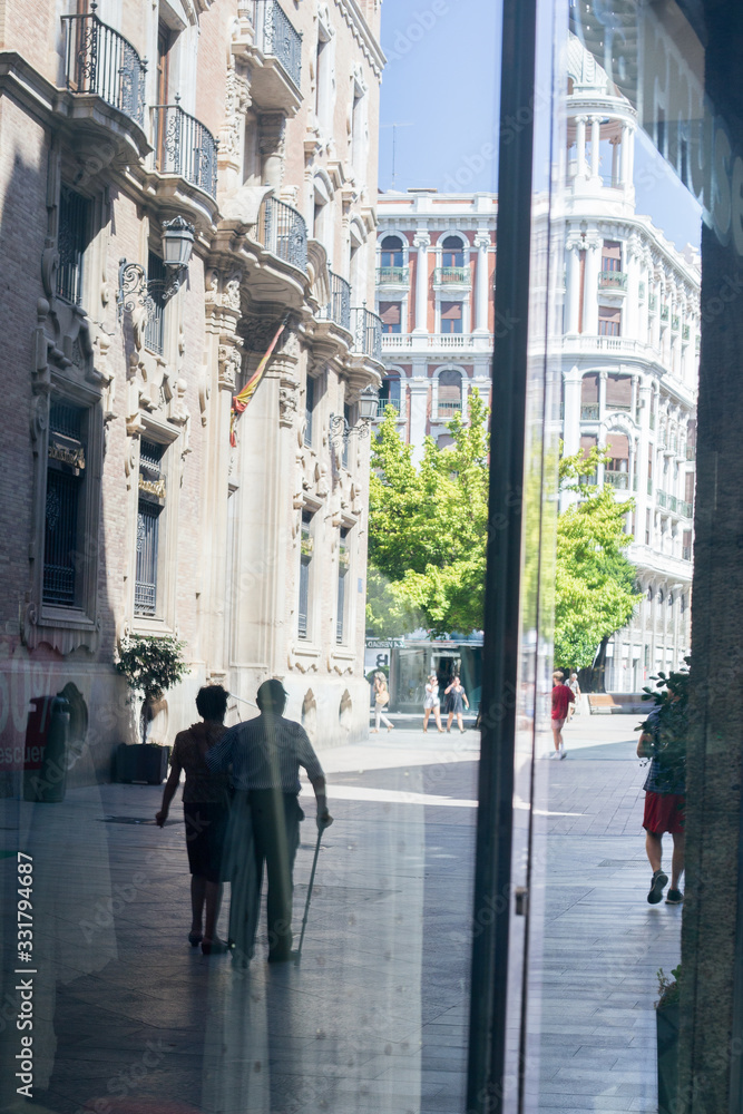 Reflection of a man in a window outside Reflection of a man in a window outside