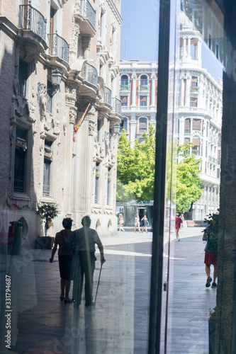 Reflection of a man in a window outside