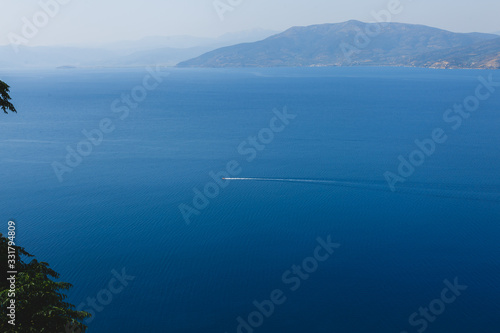 Seaview from the casstle of Naphplion. Ferry sails while sea. Greece.