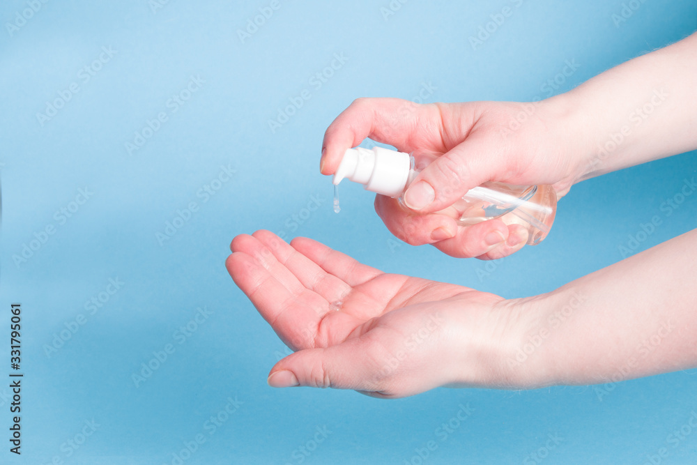 Female hands squeeze gel with a disinfectant in the palm of your hand, personal hygiene concept, protection against coronavirus, stop coronavirus Female hands squeeze gel with a disinfectant in the palm of your hand, personal hygiene concept, protection against coronavirus, stop coronavirus