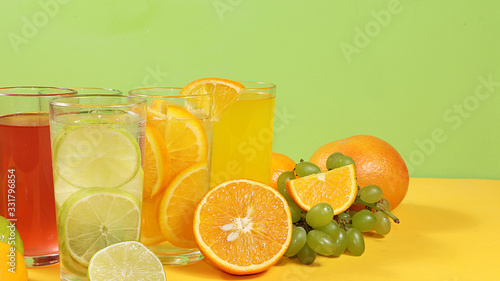 Citrus cider  juice  drink and ingredients on a color table. The concept of detox diet and weight loss  natural nutrition  increasing the body s immunity against viruses and colds