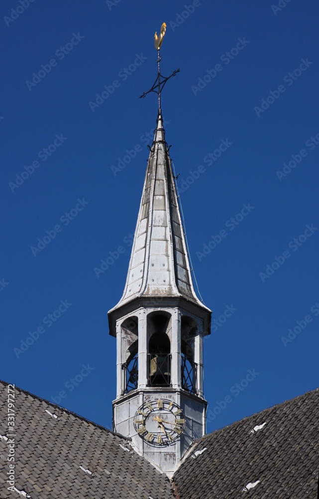 Crossing tower in the form of a ridge turret on the Burgh-Haamstede village church roof in the Netherlands