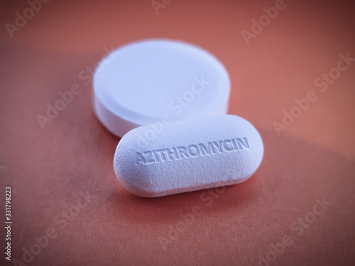 Tablet of azithromycin on table. Medication drug antibiotic for treatment bacterial infections such as Chlamydia, Gonorrhea and Malaria and potential COVID19 coronavirus