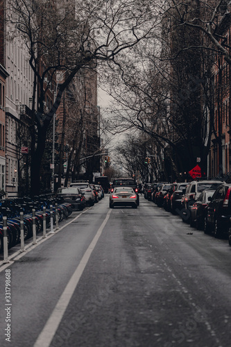 New York City streets of Manhattan. Big city life in New York State. Manhattan streets full of people and yellow taxi. Busy district streets. Skyscrapper buildings. Historical buildings.