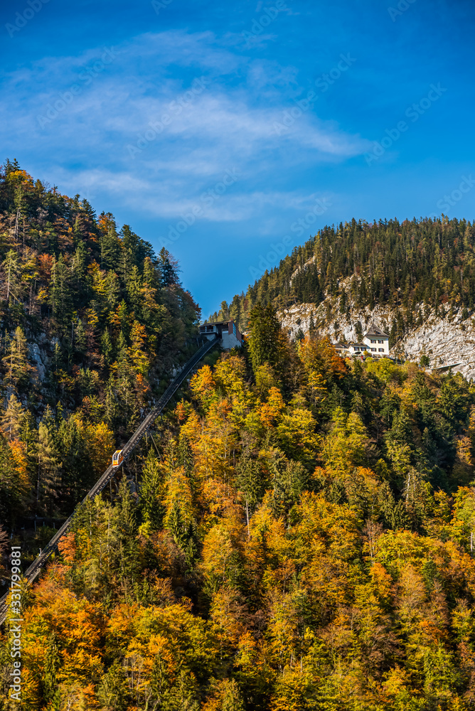 Autumn colored hillside with the funicular of Hallstatt, Austria