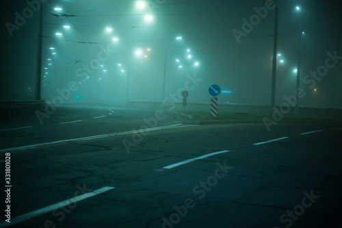 Highway road at night in the fog in the city © Hennadii