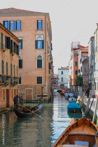 Traditional Venice Cityscape with narrow canal, gondola © funbox