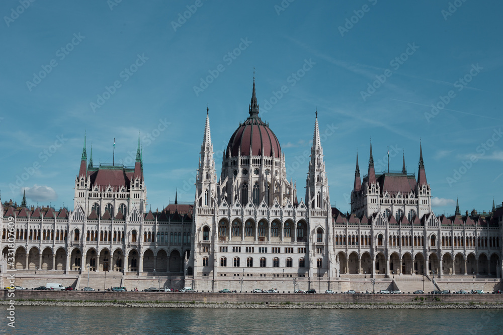 Fototapeta premium Budapest Parliament Building in the afternoon against a clear blue sky