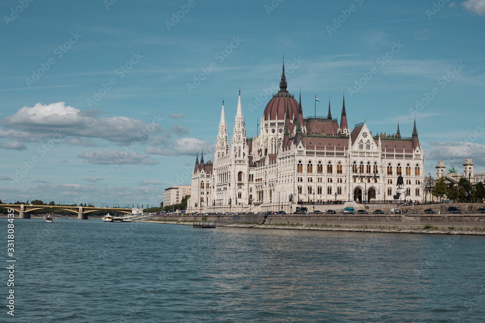Fototapeta premium Budapest Parliament Building in the afternoon against a clear blue sky