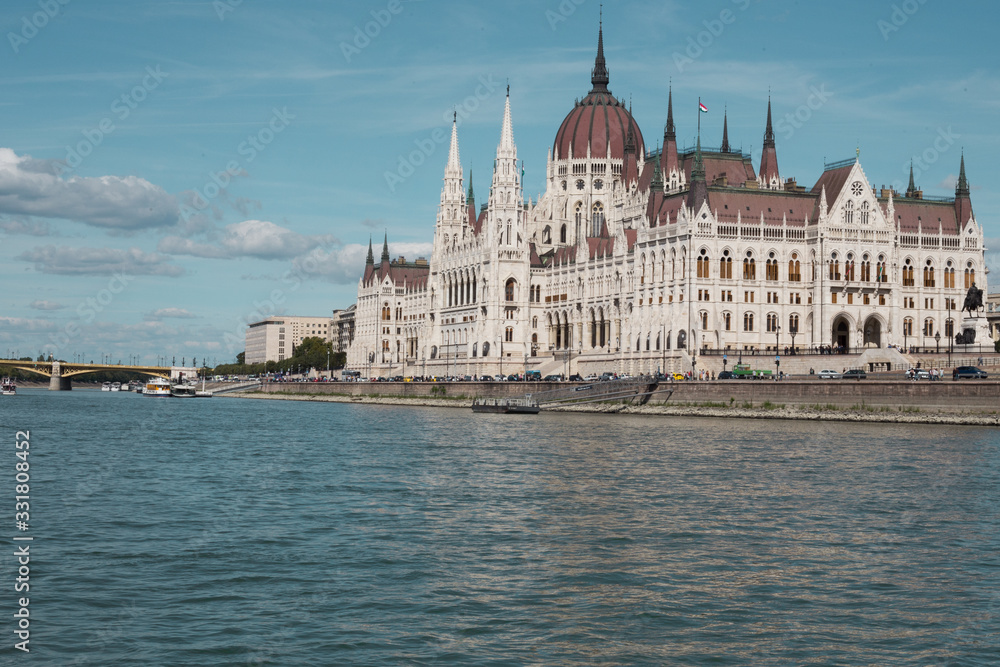 Fototapeta premium Budapest Parliament Building in the afternoon against a clear blue sky