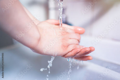 Washing hands under running water using soap  important step for a good hygiene
