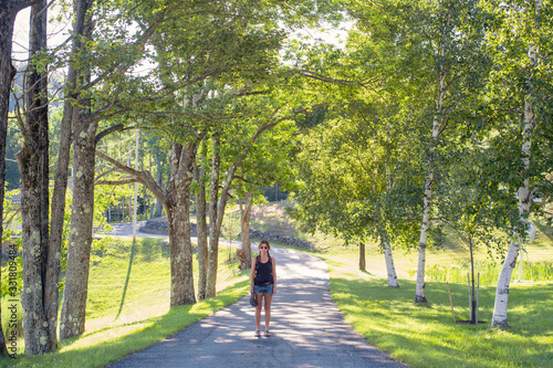 Wallpaper Mural Woman on a road in the forest Torontodigital.ca