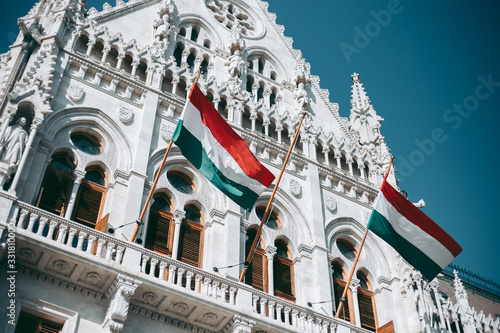 Hungary flag on the facade of the Budapest Parliament Building