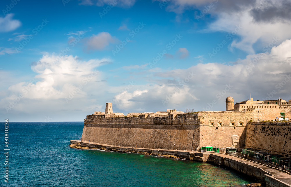 The Saint Elmo Bay and the city walls of Valletta, in Malta.