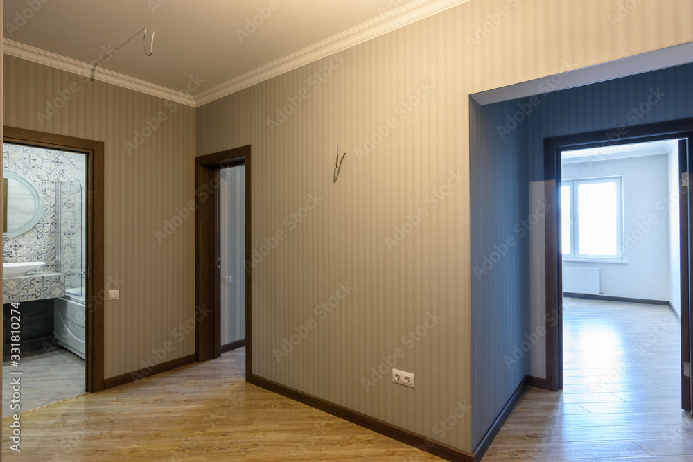 Open doors to rooms and a bathroom, view from the corridor Open doors to rooms and a bathroom, view from the corridor
