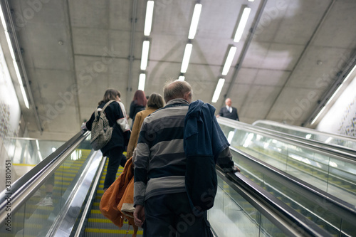 A man climbs the escalator in the subway