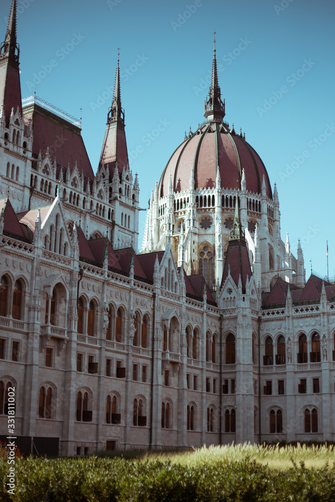 Budapest Parliament Building in the afternoon against a clear blue sky
