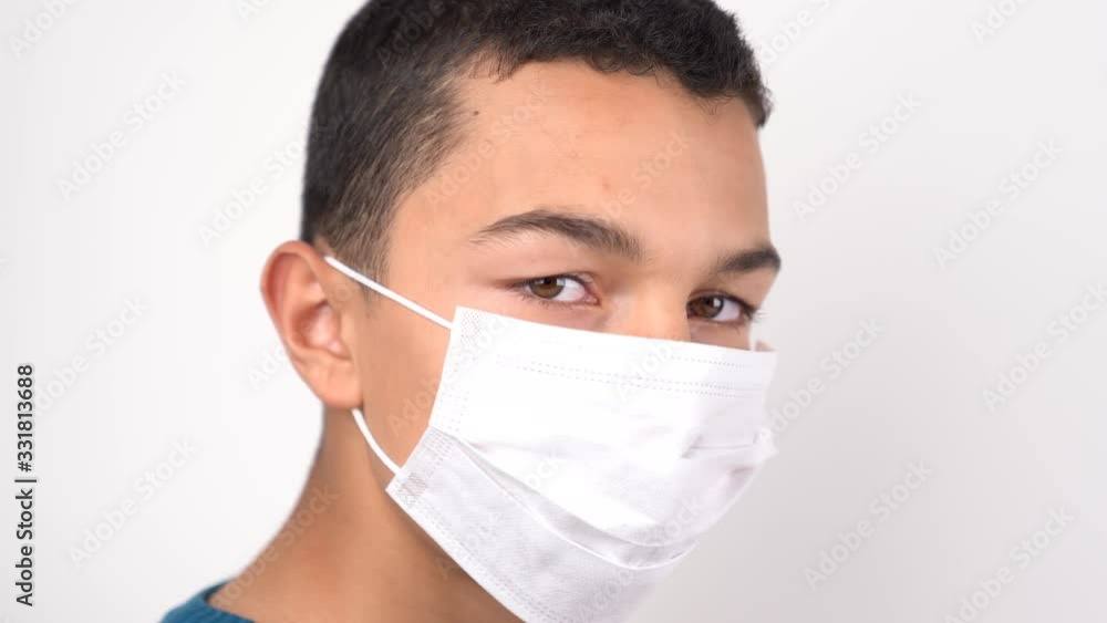 A young boy put on mask to ptoroect from Corona virus. Covid19. Qurantina. A young boy put on mask to ptoroect from Corona virus. Covid19. Qurantina.