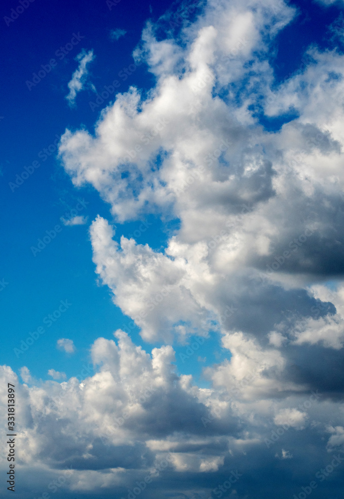 Thick white clouds form in a deep blue sky over Michigan USA Thick white clouds form in a deep blue sky over Michigan USA