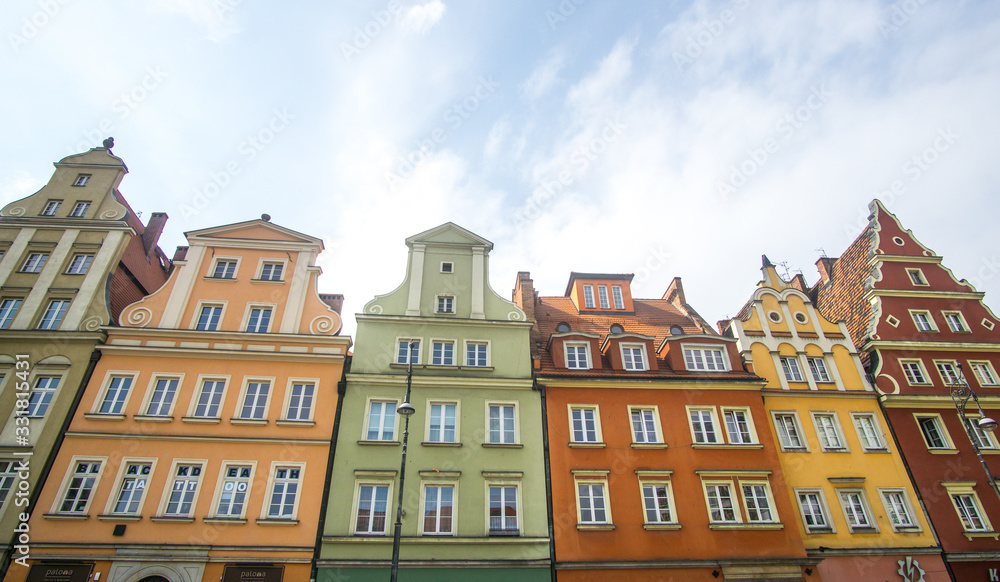Fototapeta premium The Market Square in the city center of Wrocław city in Poland. in the picture you see the old colorful buildings and the Old town hall building