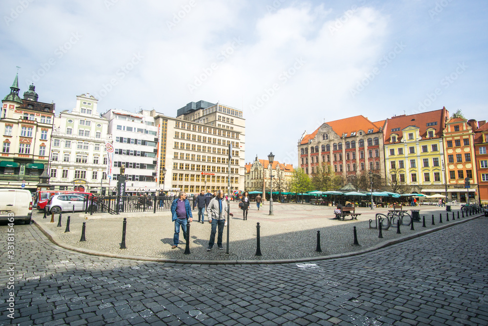 Naklejka premium The Market Square in the city center of Wrocław city in Poland. in the picture you see the old colorful buildings and the Old town hall building