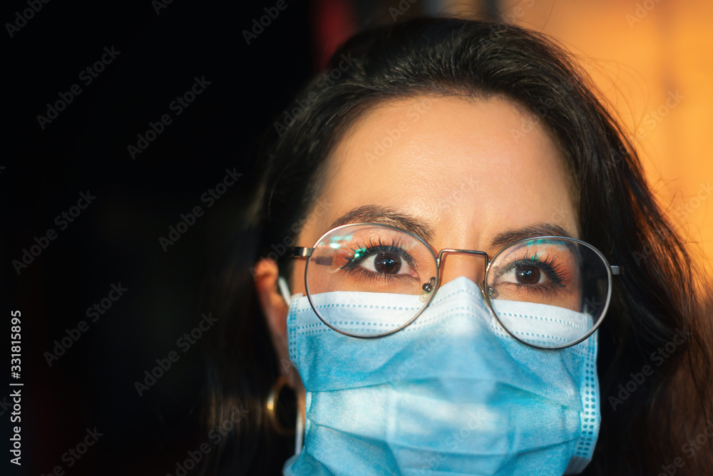 woman wearing a mask during the time of the COVID-19 coronavirus pandemic woman wearing a mask during the time of the COVID-19 coronavirus pandemic