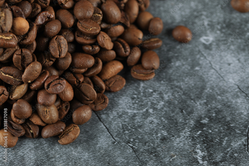 Fresh coffee beans for wholesale, on the left corner of the background Fresh coffee beans for wholesale, on the left corner of the background