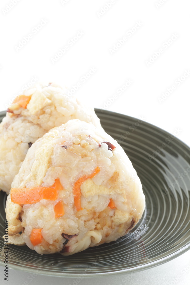 Japanese food, chicken and carrot rice ball on dish Japanese food, chicken and carrot rice ball on dish