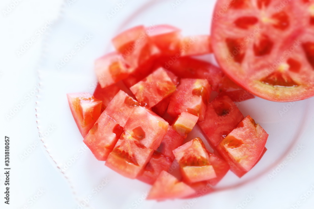 Chopped tomato on dish for prepared food image