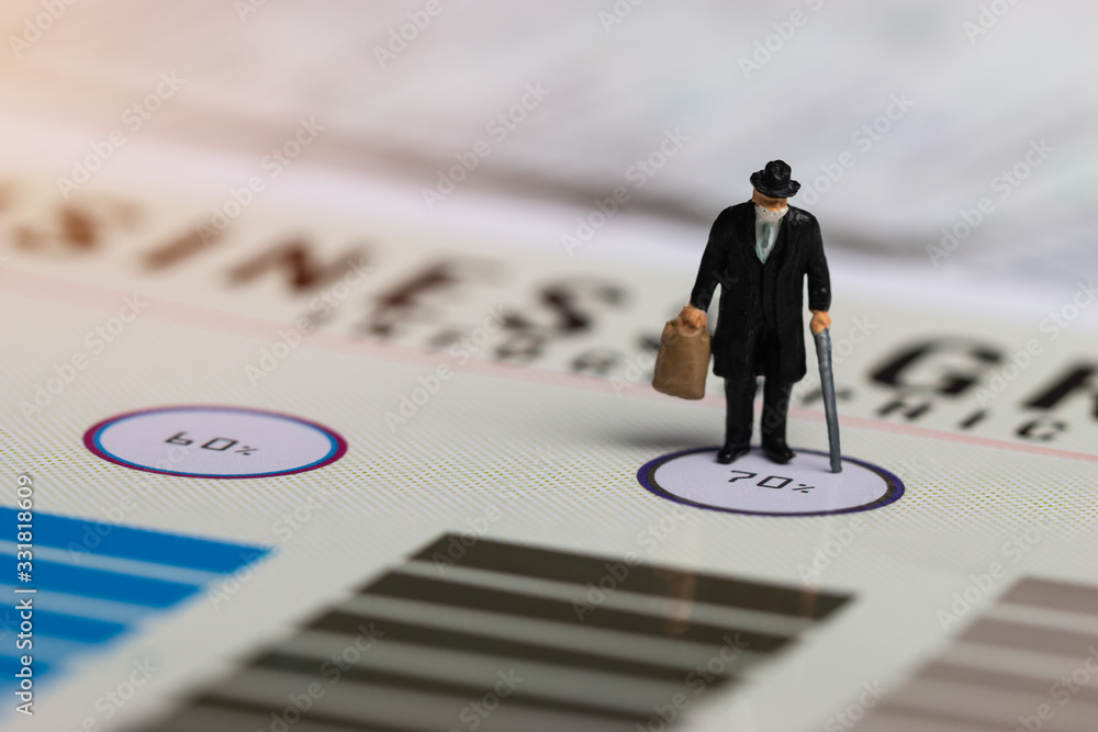 Business man, Miniature figurine wear mask wearing surgical mask protective Coronavirus 2019-ncov,COVID19, standing on report wealth paper index. Concept of online ecommerce mortar stores  competition