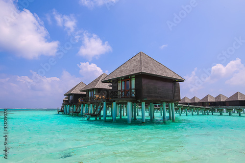 Water bungalows at the floated resort at the Maldives, small island nation in South Asia, located in the Arabian Sea. Olhuveli Beach Spa Resort Guraidhoo. The heaven on earth with turquoise water 