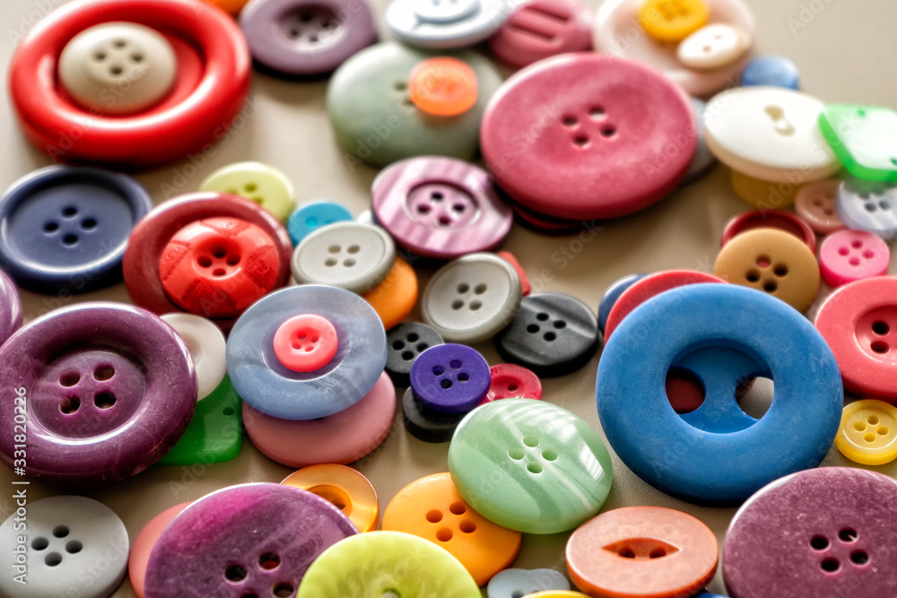 Many colorful garment buttons in various shapes and sizes Many colorful garment buttons in various shapes and sizes
