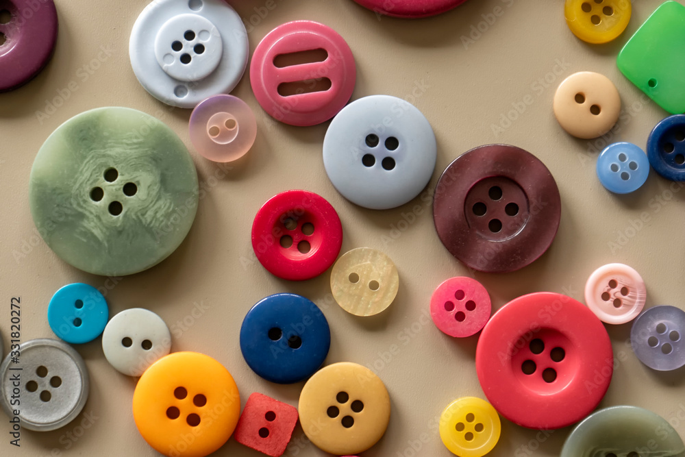 Many colorful garment buttons in various shapes and sizes Many colorful garment buttons in various shapes and sizes