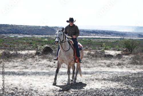 man riding horse © Cuauhtemoc