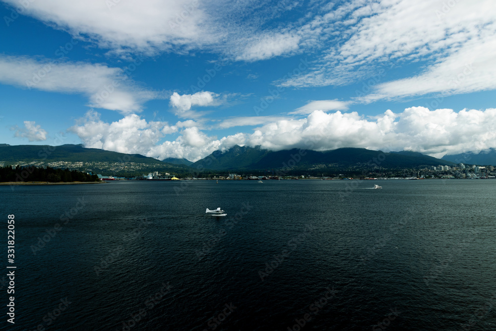 Seaplane landing at a distance, Vancouver, BC, Canada