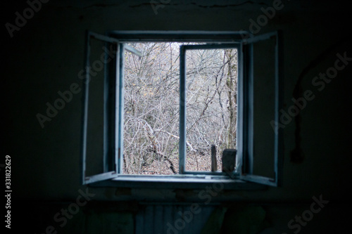 Old windows in the house in Pripyat in Chernobyl
